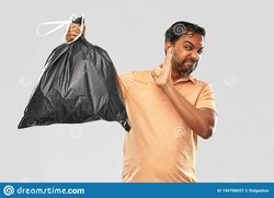 recycling-sorting-sustainability-concept-young-indian-man-holding-stinky-trash-bag-over-grey-background-indian-man-holding-194708657.jpg